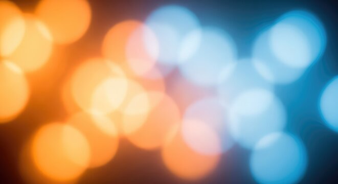 Vibrant abstract background featuring a mix of warm orange and cool blue bokeh lights glowing softly in a dreamlike, festive composition, lights, radiant, yellow