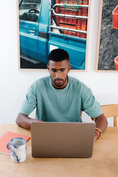 A lone entrepreneur working from home with a computer