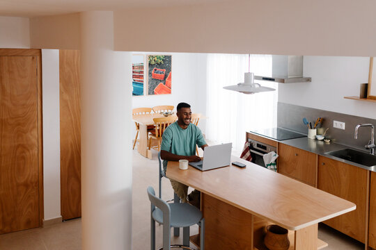 Freelancer operates an online business from a kitchen at home