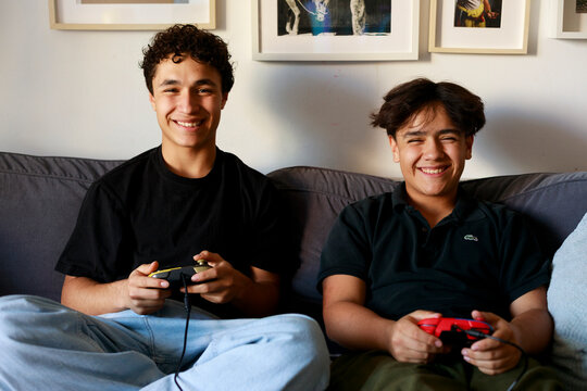 Two Boys Enjoy Gaming at home