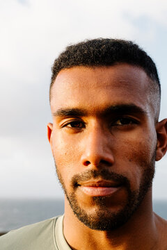 Headshot of a Black athlete looking directly at the camera