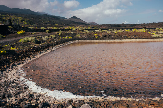 Saline pond amid volcanic landscape on La Palma island