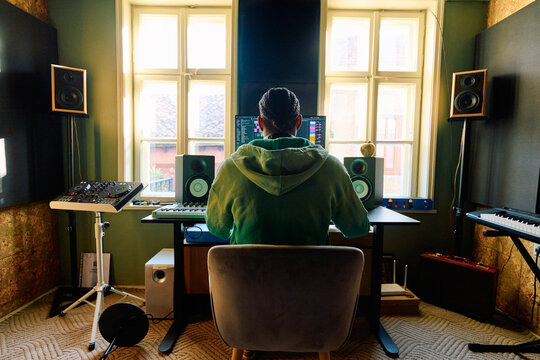 Black Music Producer Working in Professional Home Studio Environment
