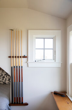 Stick Pool billiard Cue on rack in home  Playroom 
