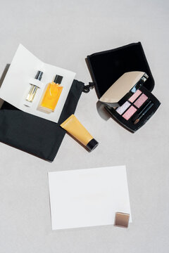 Beauty Gift Set with Perfume Samples and Makeup Flat Lay