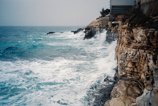 Waves crashing against rocky coastal cliffs