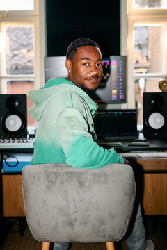 Portrait of Black Music Producer in Home Studio Environment