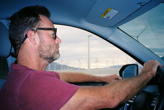 Man drives a car on the open road