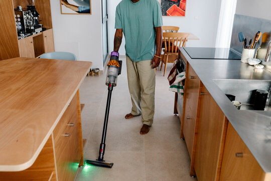 Modern man who enjoys balancing remote work with household