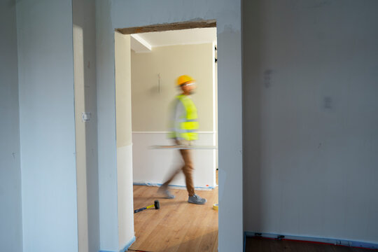 Worker moves through new construction site