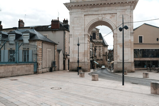Historic Arch Stands in a Quiet Urban Area on a Cloudy Day
