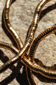 Gold Metal Loops Arranged on a Surface