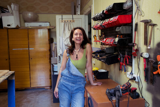 A woman spends time in her furniture restoration studio
