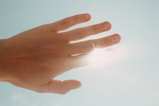 hand blocks the sun