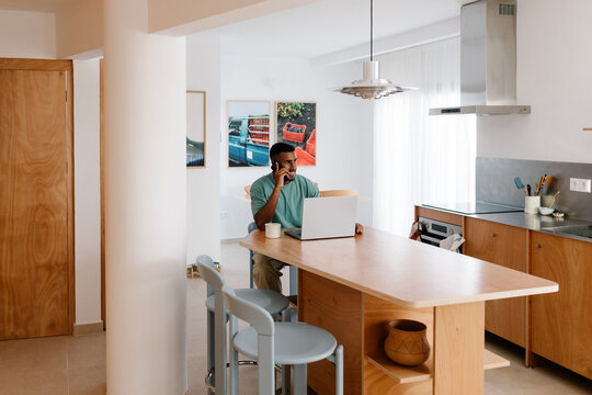 A freelancer takes business calls during a productive day at home