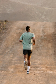 A rare full-length view shows a professional trail athlete exercising