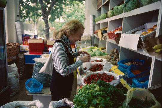 Buying Strawberries at Market