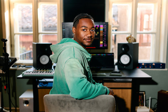Portrait of Black Music Producer in Home Studio Environment