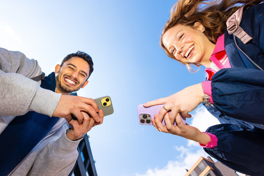 Smiling couple with phones