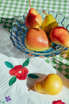 Colorful fruits placed on a table with a checkered pattern