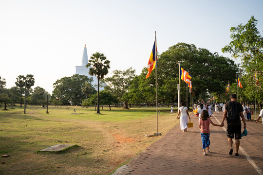 People Walk to Buddhist temple. Anuradhapura, Sri Lanka.