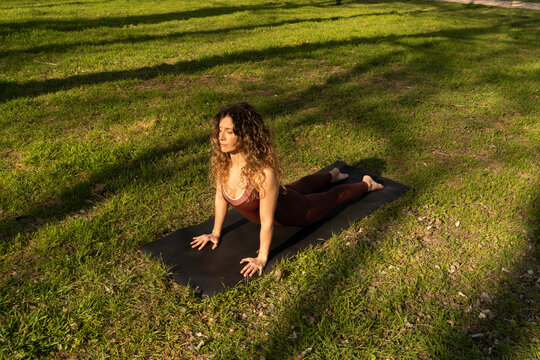 Spring yoga outdoors on sunny grass