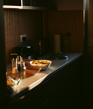 Everyday kitchen routine with ingredients for pasta. 