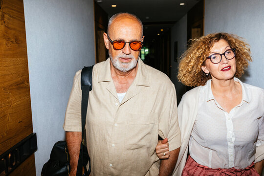 Senior Couple Checking in the Hotel on Vacation