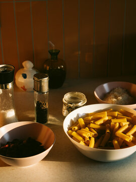 Everyday kitchen routine with ingredients for pasta. 