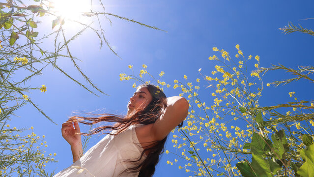 Girl in a Field with Flowers