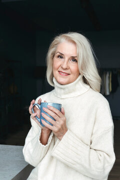 Smiles and Warmth in a Cozy Moment With a Steaming Cup