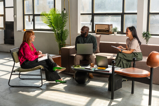 Casual Business Meeting With Colleagues  in Industrial Open Space