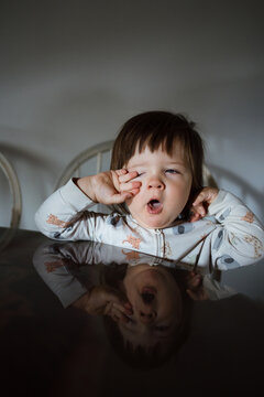 Toddler Yawning and Stretching in a Home Setting During Morning