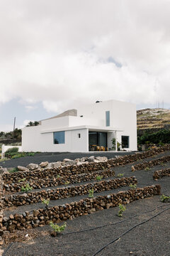 A broad view captures the back exterior of a modern minimalist home
