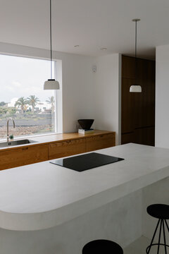 A general view of a modern kitchen with a huge window