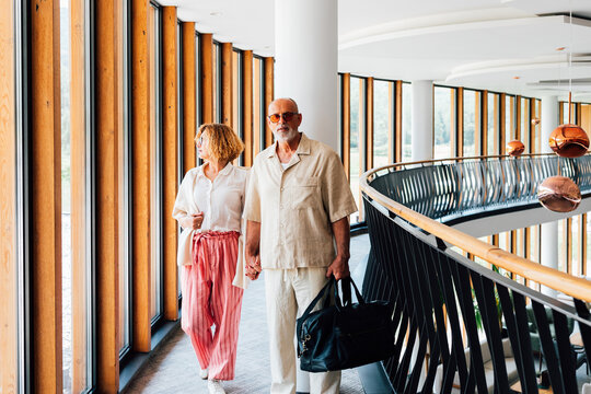 Senior Couple Checking in the Hotel on Vacation