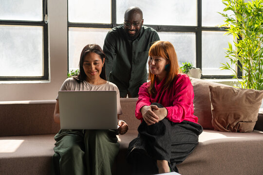 Diverse Team Having Video Call During Casual Office Meeting