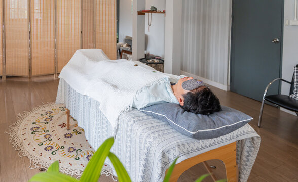 Person Receiving Relaxation Treatment in Treatment Room