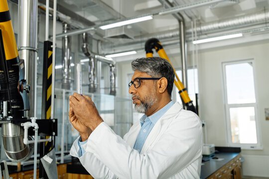 Indian scientist in white coat working in laboratory