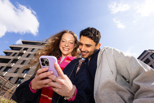 Couple sharing cellphone joy