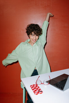 Woman stretching arms and back after work
