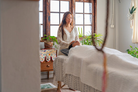 Healing Session in Bright Room With Plants and Natural Light