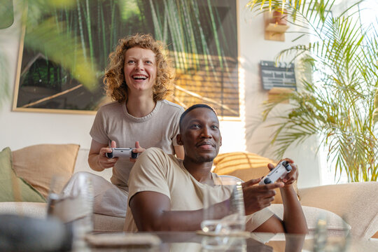 Couple Holding Joysticks
