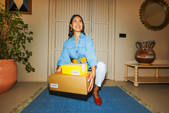Woman receiving packages at home, online shopping delivery ugc