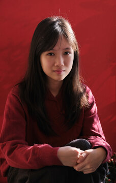 A young Chinese girl on a balcony during Chinese New Year.closeup