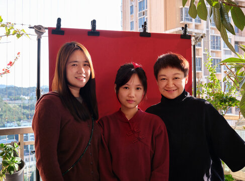 Three Chinese women on a balcony during Chinese New Year