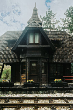 Wooden railway station building in mountain setting