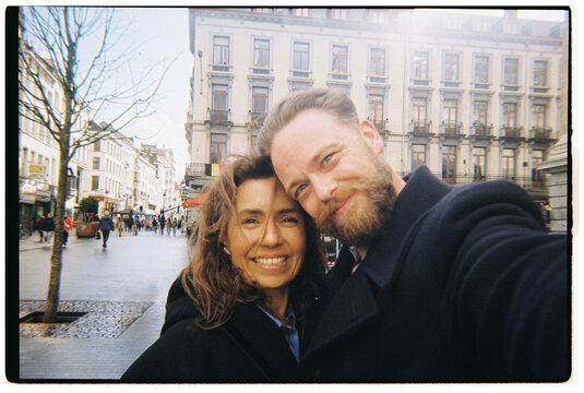 Couple Enjoys a Moment in a Busy City Street in Brussels