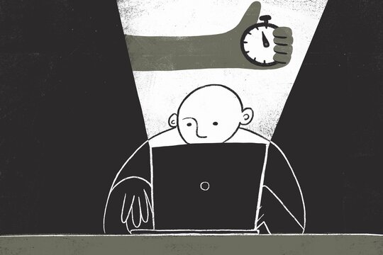Man working on a laptop late at night 