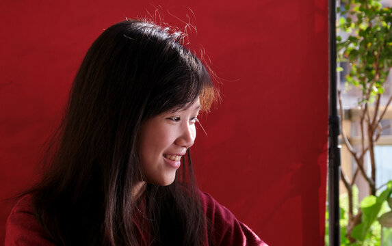 A young Chinese girl on a balcony during Chinese New Year. closeup